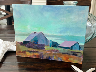 11x14 Oil on Board.  Painting of a coastal scene with houses on a wooden table, surrounded by starfish.